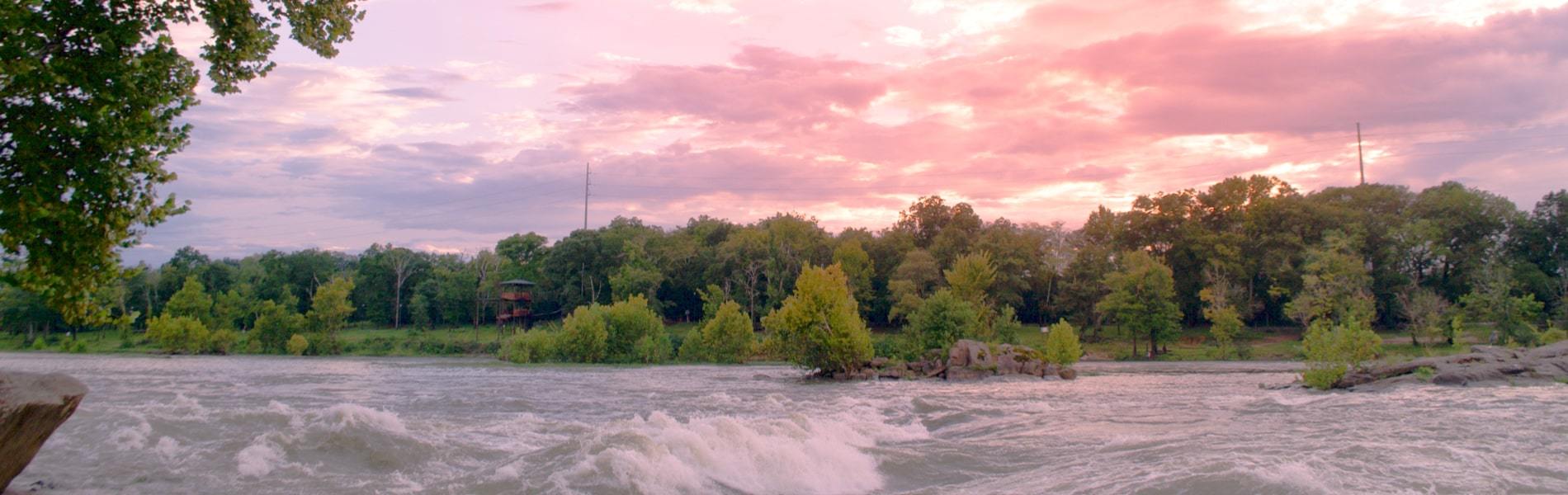 Colorful sunset over rushing waters in North Columbus 